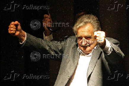 FILE PHOTO: Uruguay's president-elect Jose Mujica celebrates winning the presidential run-off election in Montevideo