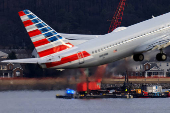 FILE PHOTO: Aftermath of American Eagle flight 5342 crash in the Potomac River near Ronald Reagan Washington National Airport