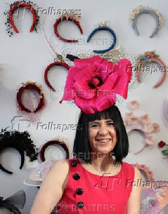 Milliner Merve Bayindir wears one of her hat creations as she speaks to Reuters ahead of the Ascot horse racing festival, in London