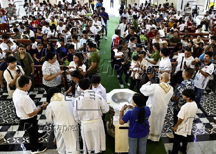 Mass baptism ceremony for children in Bacoor city