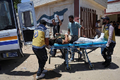 Casualties from recent clashes in Sweida receive treatment at a field medical point in Deraa
