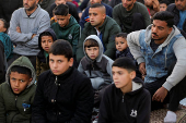 Palestinian Muslims attend Eid al-Fitr prayer in Jabalia