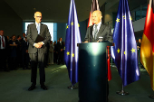 German Chancellor Olaf Scholz hands over to his successor Friedrich Merz