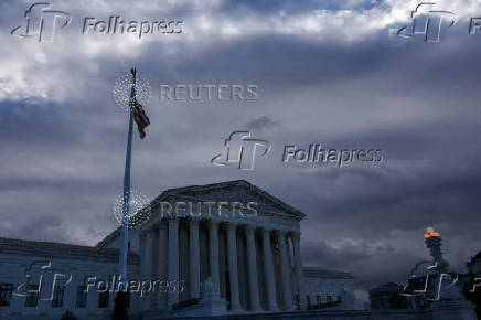 FILE PHOTO: U.S. Flag flutters outside of the United States Supreme Court Building in Washington