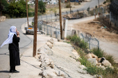 FILE PHOTO: Israeli Druze look over the border between the Israeli-occupied Golan Heights and Syria, in Majdal Shams