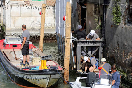 Beginning of the restoration process of Banksy's 'Migrant Child', in Venice