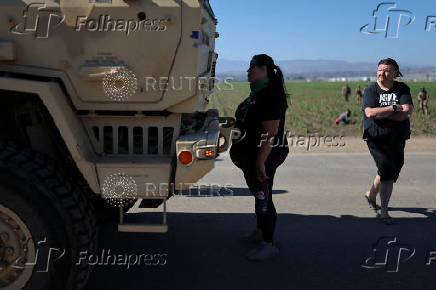 U.S. federal agents and immigration officers raid an agricultural facility in Camarillo