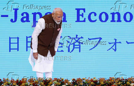 India's Prime Minister Modi bows to participants after speech at the India-Japan Economic Forum in Tokyo
