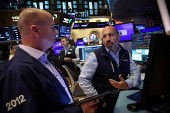 Traders work on the floor of the NYSE in New York