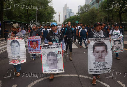 Demonstrators march to demand justice for the disappearance of students of Ayotzinapa Rural Teachers' College, in Mexico City