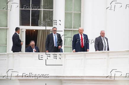 US President Trump walks on roof of the West Wing of the White House