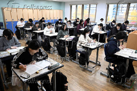 FILE PHOTO: South Korean students wait to take the annual College Scholastic Ability Test at a school in Seoul