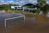 A drone image shows a flooded football field following the rise of the Solimoes River in the rural area of Manacapuru