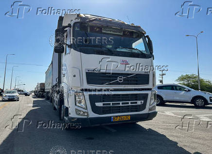 Protesters blockade humanitarian aid trucks bound for Gaza at a police checkpoint near Kerem Shalom crossing