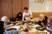 Zainab Khalifeh serves food at her home a part of which is her restaurant called 'Zainab's table' in the town of Sarafand