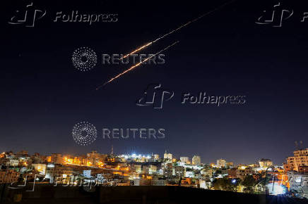 Missiles launched from Iran towards Israel are seen from Hebron