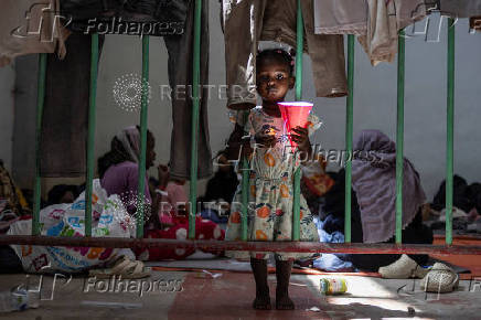 Newly-arrived migrants are sheltered in a municipal hall in the town of Agyia, Crete island