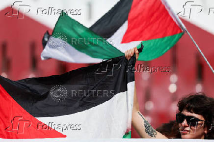 Supporters gather to call for Palestinian protest during the 82nd Venice Film Festival