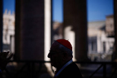 A cardinal walks in St. Peter's Square ahead of the conclave which will be held on May 7, at the Vatican
