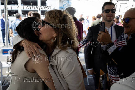 Naturalization ceremony for new U.S. citizens aboard USS New York in Fort Lauderdale