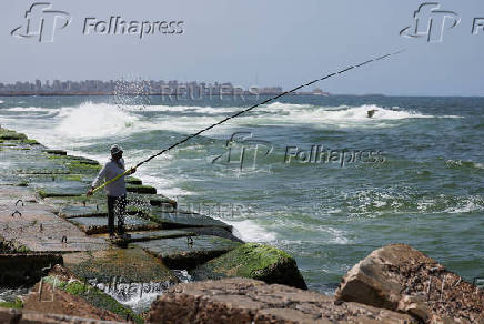 A view shows an Alexandrian citizen fishing on the corniche in the Mediterranean city of Alexandria