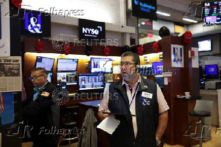 Traders work on the floor at the New York Stock Exchange (NYSE) in New York City