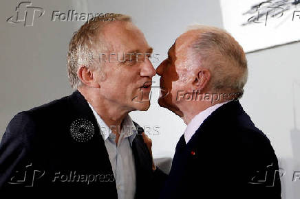 FILE PHOTO: Billionaire French art collector Francois Pinault says goodbye to his son Francois-Henri Pinault after a news conference at the 
