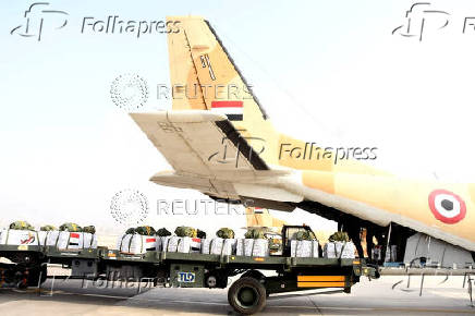 Humanitarian aid packages for Gaza sit in a vehicle before being loaded into an aircraft in Cairo