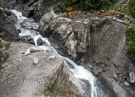 A drone view of BRO and SDRF officials attempting to build a makeshift bridge in Gangnani