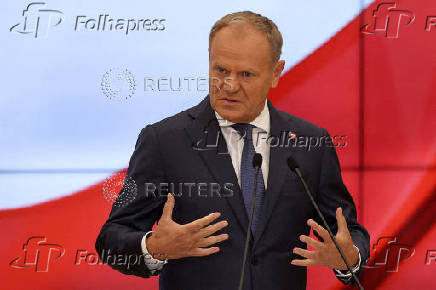 FILE PHOTO: Polish Prime Minister Donald Tusk speaks during a press conference