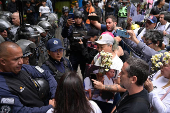 Relatives of detained Venezuelans, walk to the Miraflores presidential palace, in Caracas