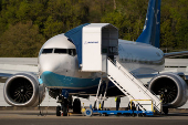 A Boeing jet intended for use by a Chinese airline returns to Boeing Field, in Seattle, Washington