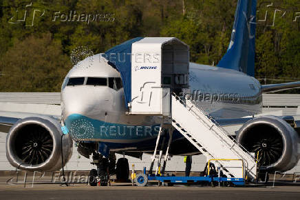 A Boeing jet intended for use by a Chinese airline returns to Boeing Field, in Seattle, Washington