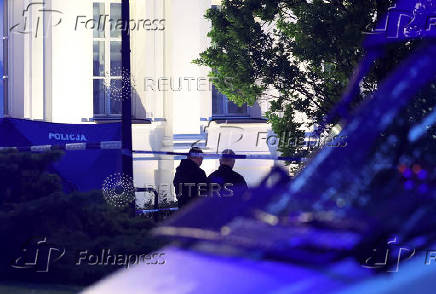 Polish police secure an earea at the Warsaw University after an attack with an axe