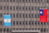 The national flags of Taiwan and Guatemala flutter outside the Presidential Office Building in Taipei