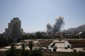 Smoke rises after strikes on Syria's defense ministry in Damascus