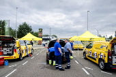Vacationers have their vehicles checked at the border crossing with Belgium