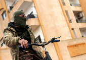 FILE PHOTO: Former Assad regime officers vacate homes for incoming rebel families