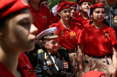 World War Two veteran Nikolai Golubtsov receives congratulations on the upcoming Victory Day in Sevastopol