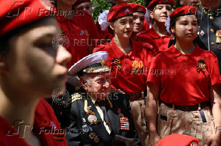 World War Two veteran Nikolai Golubtsov receives congratulations on the upcoming Victory Day in Sevastopol