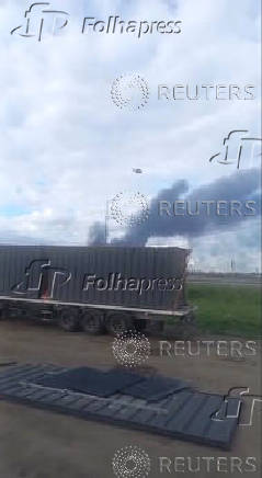 A drone lifts off from wooden sheds loaded onto a truck that was driven to the perimeter of an air base in Mal'ta