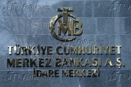 FILE PHOTO: FILE PHOTO: A logo of Turkey's Central Bank is pictured at the entrance to its headquarters in Ankara