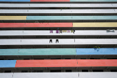 Residents hang their laundry to dry along the corridor of a public housing estate in Singapore