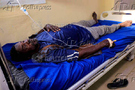 A dengue fever patient receives intravenous fluids at a hospital in Khartoum