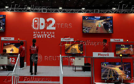 An attendee plays with the Nintendo Switch 2 gaming device at a media event in Tokyo