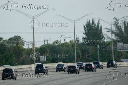 The motorcade of U.S. President Donald Trump arrives at his golf course in Jupiter, Florida