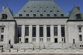 A pedestrian walks outside the Supreme Court of Canada in Ottawa