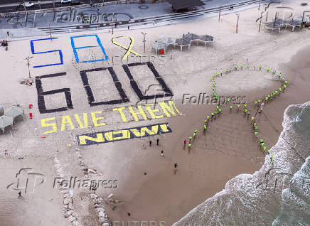A drone view shows Israeli protesters display the words 