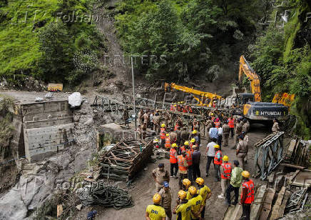 A drone view of BRO and SDRF officials attempting to build a makeshift bridge in Gangnani