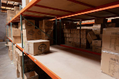 Shelves sit partially empty at the headquarters of toy manufacturer Huntar Company Inc in Union City
